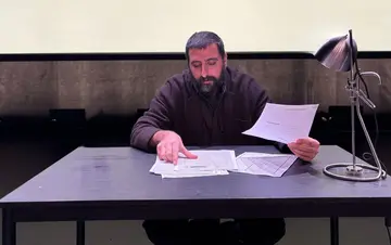 Projected and displayed documents from Amer Matar’s personal security file at HAU