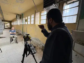 Recording a survivor testimony in a corridor inside a former Assad regime detention site