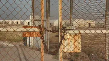 Chained entrance gate at the former Camp Bucca prison site in southern Iraq