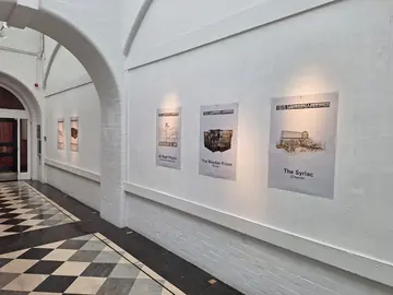 ISIS Prisons Museum case-study posters installed in the Goldsmiths exhibition corridor