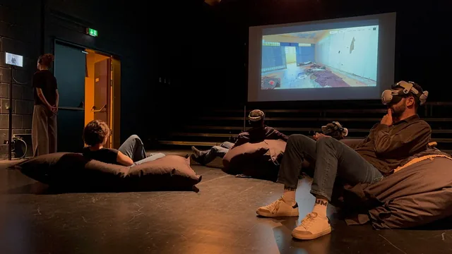 Visitors using virtual reality during the Sednaya exhibition in Hanover