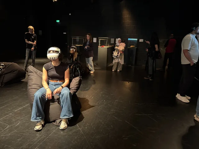 A visitor experiencing the Sednaya reconstruction through virtual reality in Hanover