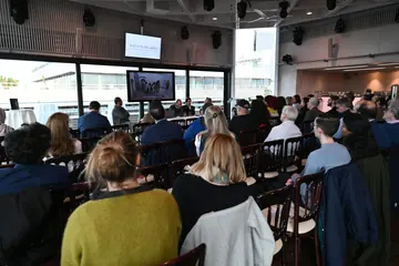 Audience at the public launch of the ISIS Prisons Museum at the National Theatre in London
