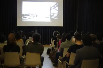 Audience watching a Syria Mobile Film Festival screening in 2016